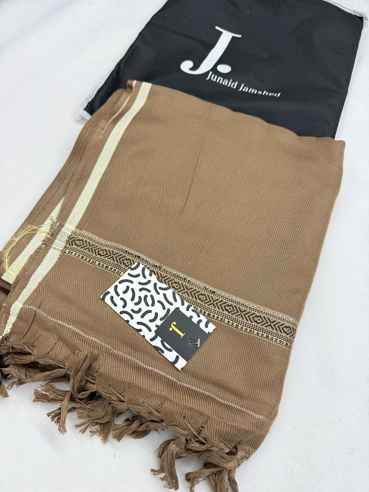 J. SHAWLS